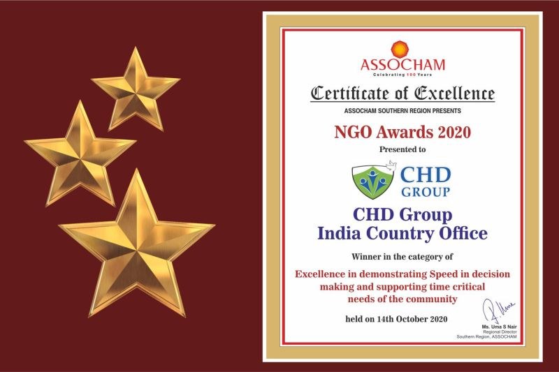 Auszeichnung der Excellence für die NGO Awards 2020 mit dem Text "Chd Group India Country Office" und einem Schild-Logo mit einem zentralen Stern und einem Lorbeerkranz, umgeben von drei Sternen auf der linken Seite.