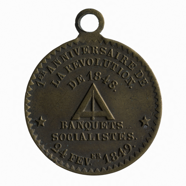 Bronze medal with "Banquets Socialistes" inscribed, on a white background.